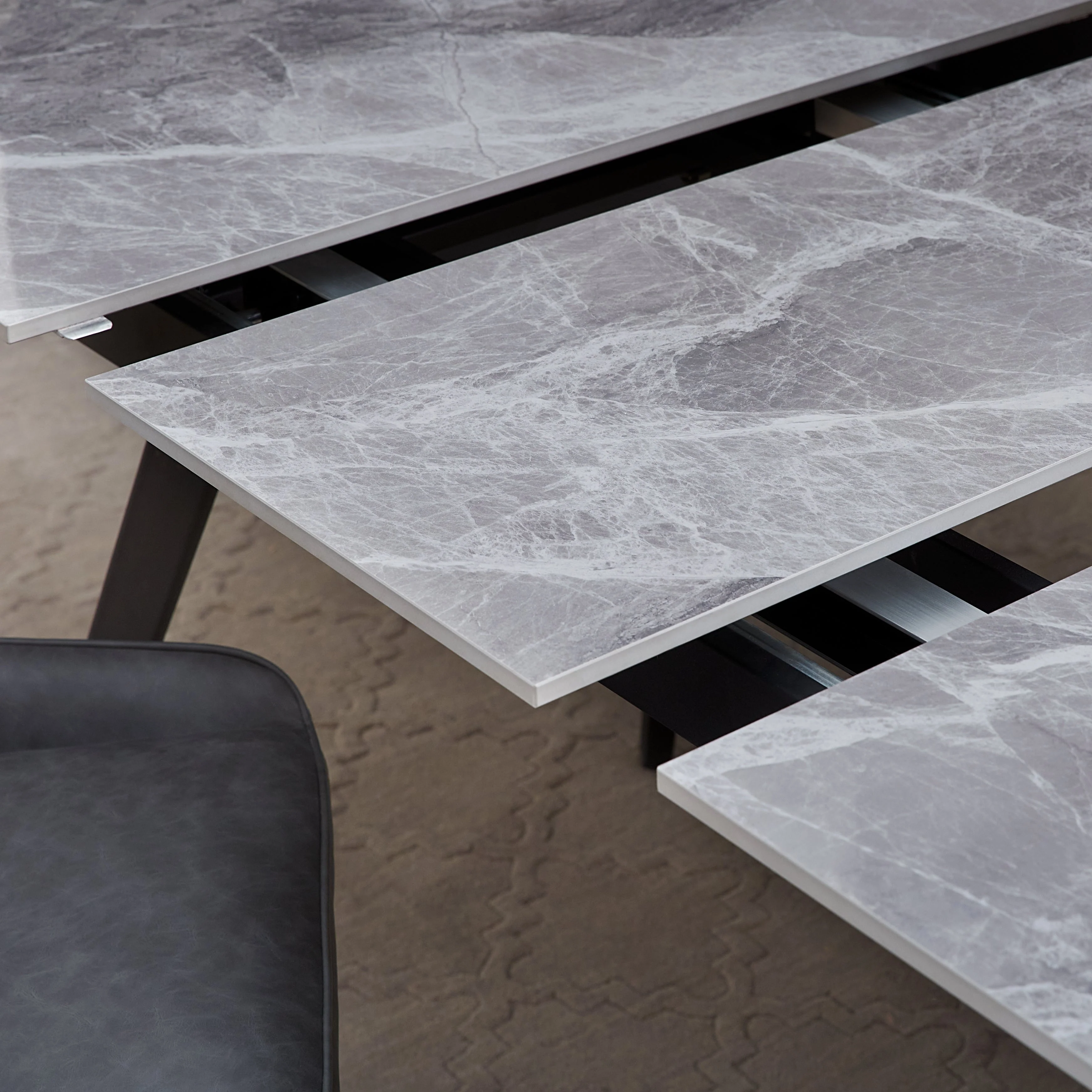 Lucia Extendable Stone Top Metal Leg Dining Table in Piedra and Black - Image 3